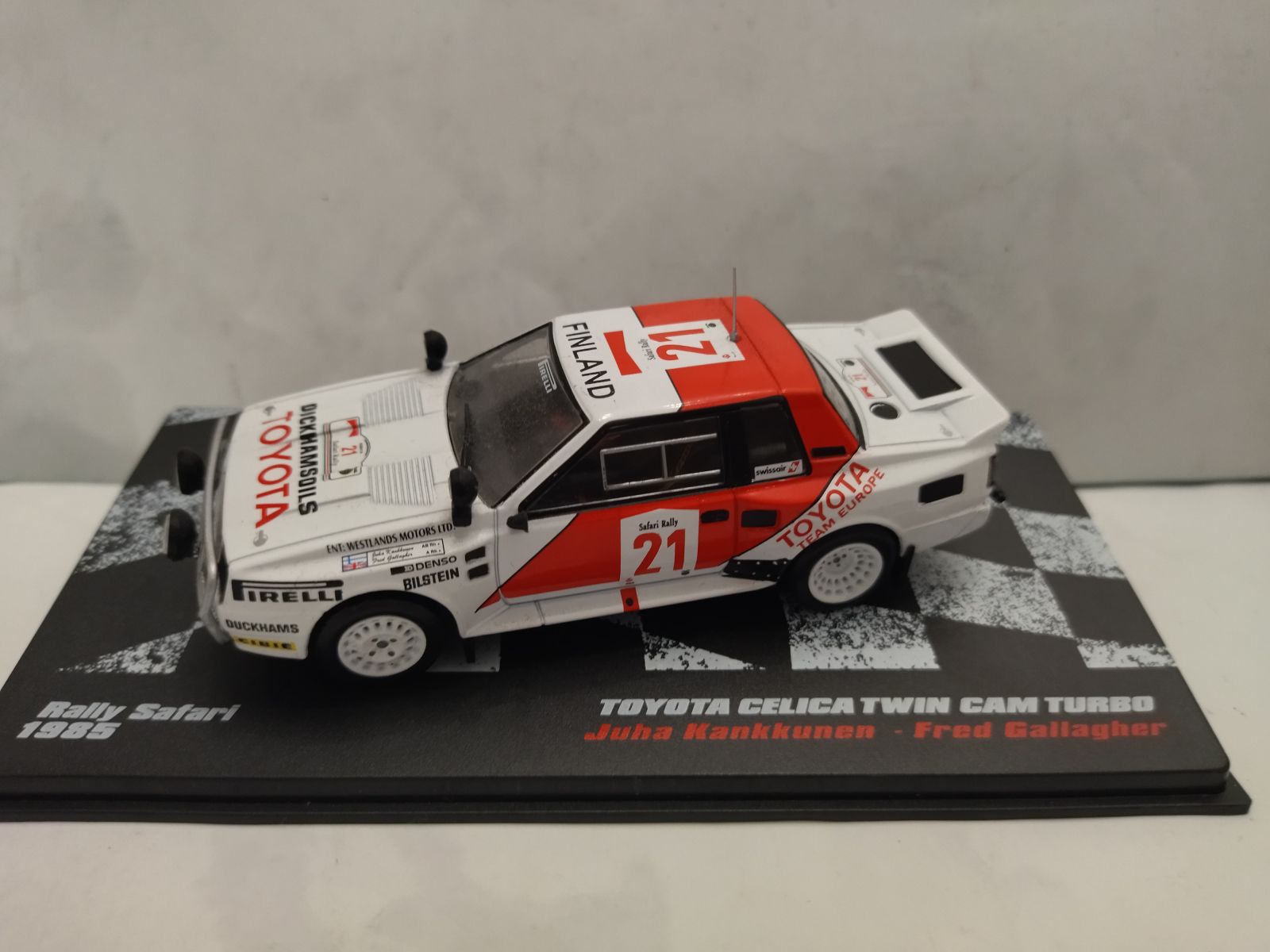 Miniature Toyota Celica Twin Cam Turbo Rallye 1985 1/18 - Modèle Kankkunen Haspengouw, Marque Otto, Résine, Neuf
